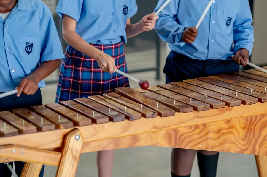 Children playing the marimba together