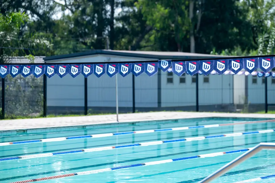 The swimming pool with lane ropes and Waterford International bunting